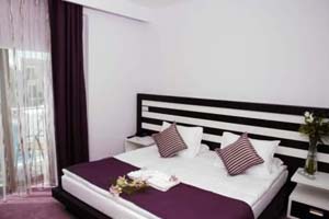 Deluxe single with pool view, balcony, private facilities (shower), and breakfast